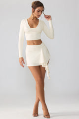 Slinky Jersey Mid Rise Ruffle Layer Mini Skirt in Ivory