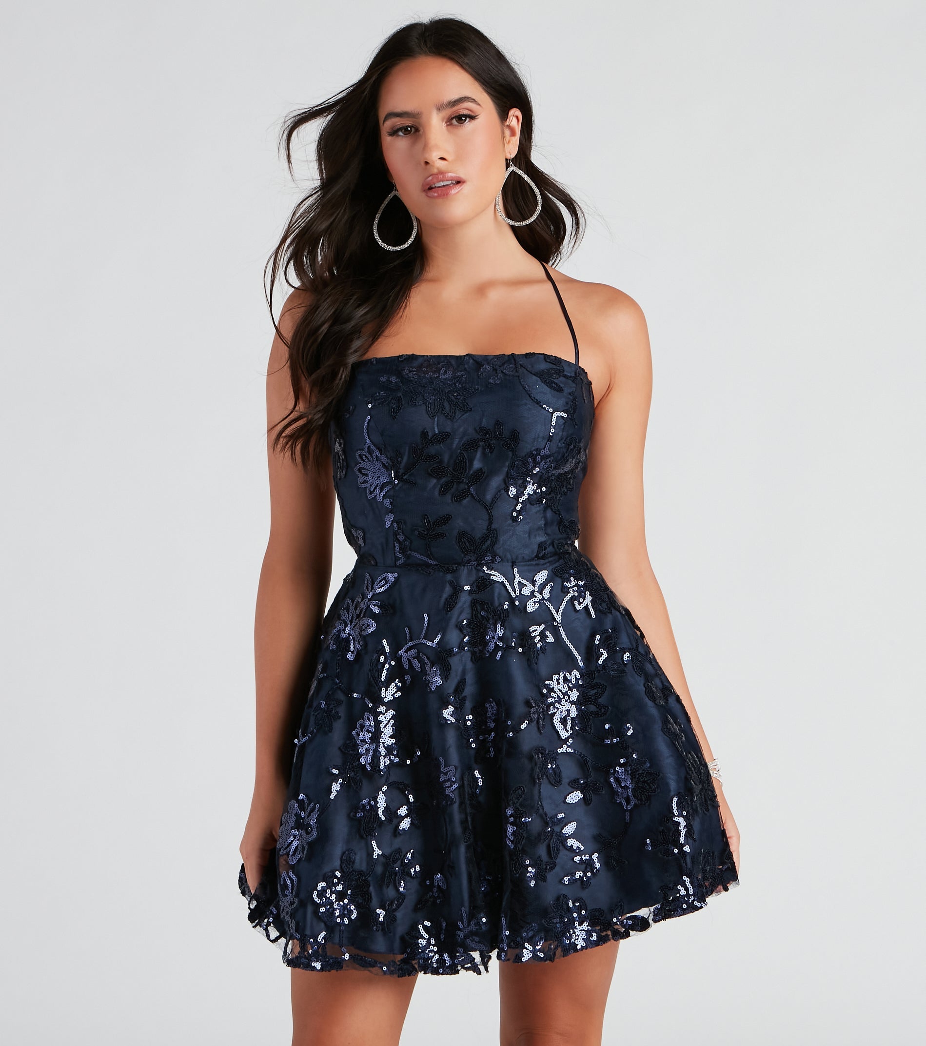 You'll be the best dressed in the Joanna Sequin Lace Party Dress as your summer formal dress with unique details from Windsor.