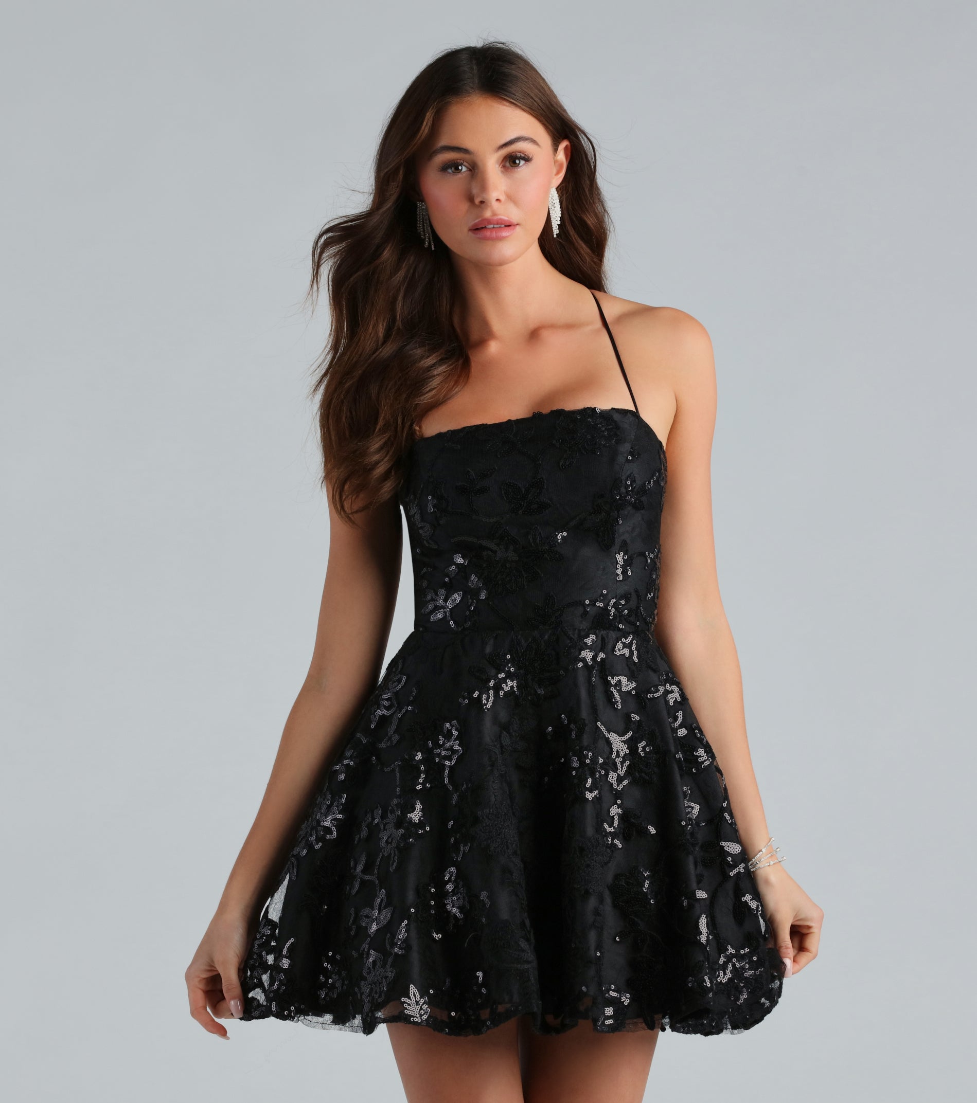 You'll be the best dressed in the Joanna Sequin Lace Party Dress as your summer formal dress with unique details from Windsor.