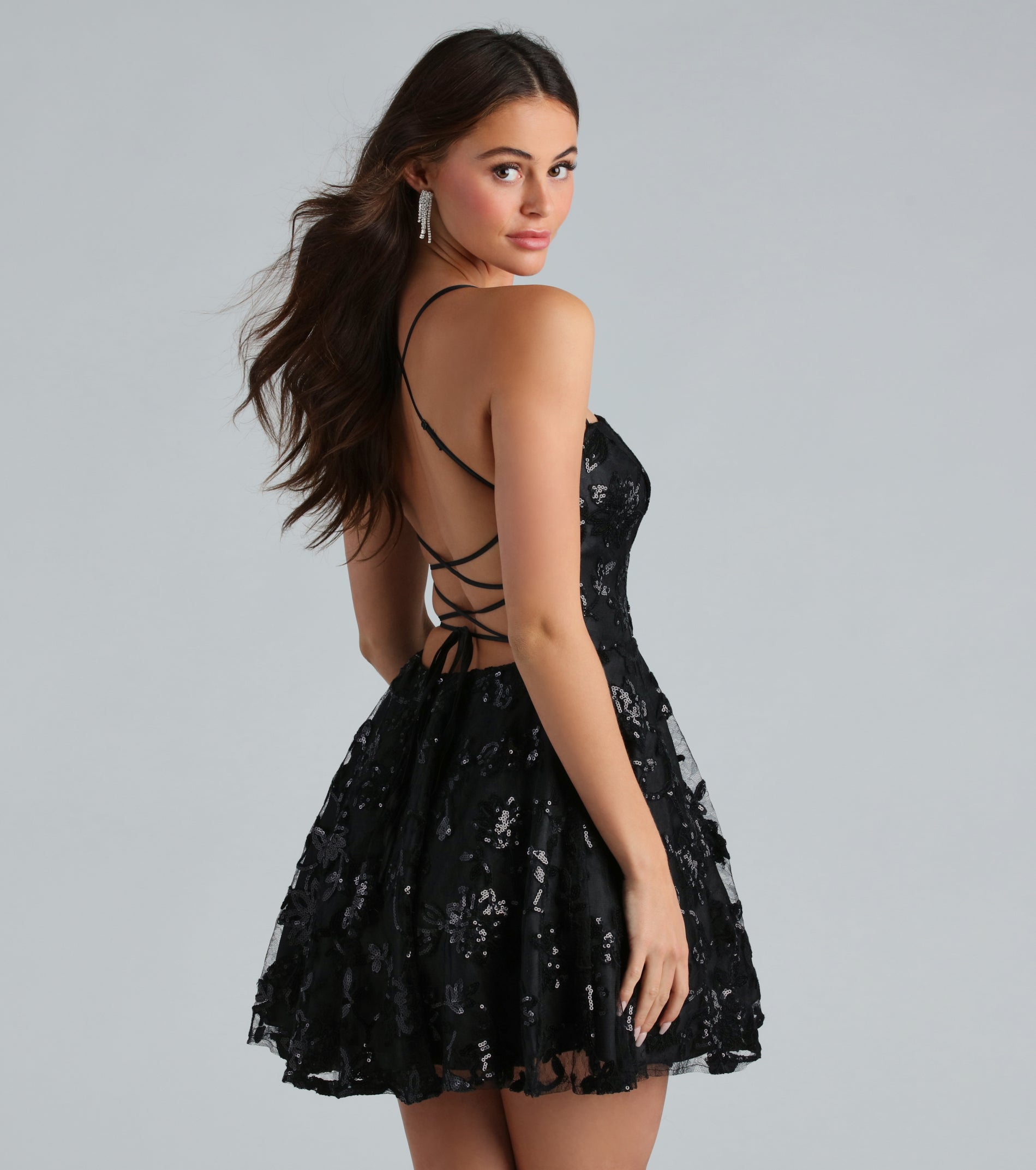 You'll be the best dressed in the Joanna Sequin Lace Party Dress as your summer formal dress with unique details from Windsor.