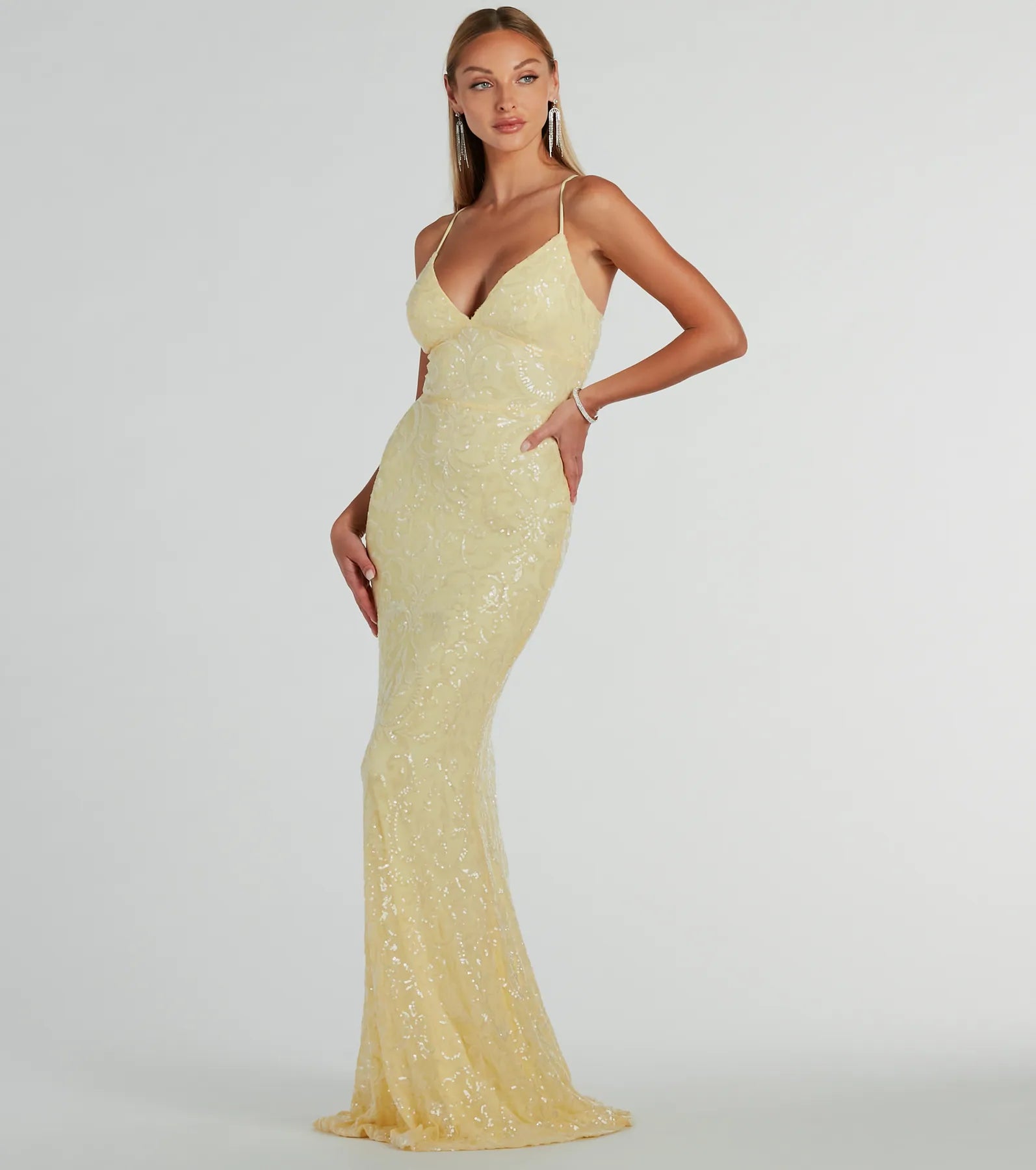 You'll be the best dressed in the Bethanie Formal Sequin V-Neck Mermaid Dress as your summer formal dress with unique details from Windsor.