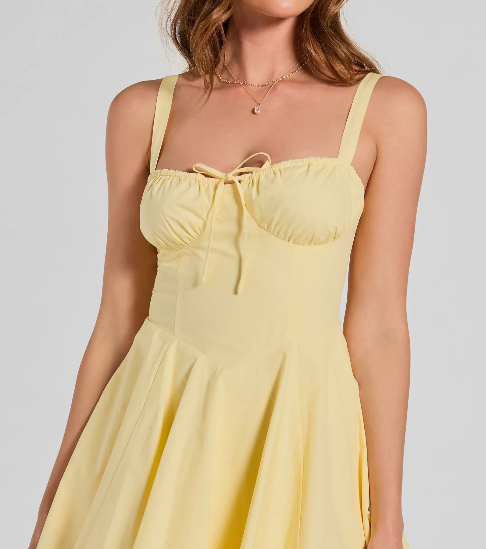 Essential for vacations or summer days, the Ray Of Beauty Lace-Up Corset Skater Dress is a sundress or milkmaid dress with sleek and flirty details.