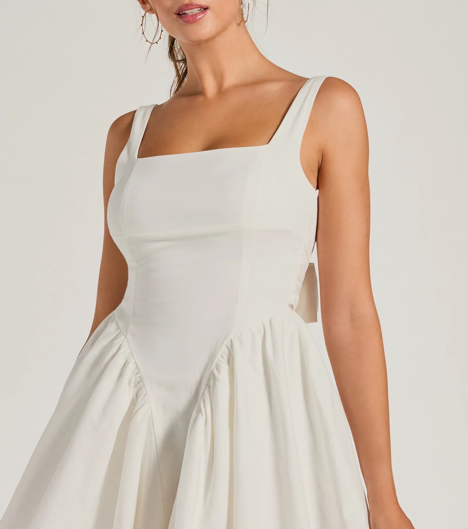 The Stunning Sweetie Open Back Bow Skater Dress is a casual dress for more than special occasions with a fitted or flowy silhouette and accents in the most recent trends!