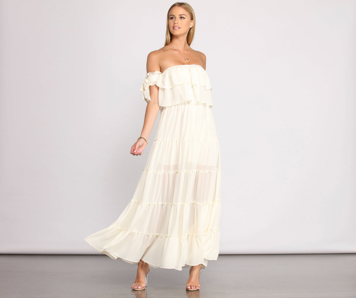 You will feel beautiful in the Ruffled Romance Off The Shoulder Maxi Dress as your long dress for any semi-formal or formal holiday party, NYE dress outfit, or pick this stunning style as your gown for any seasonal celebration.