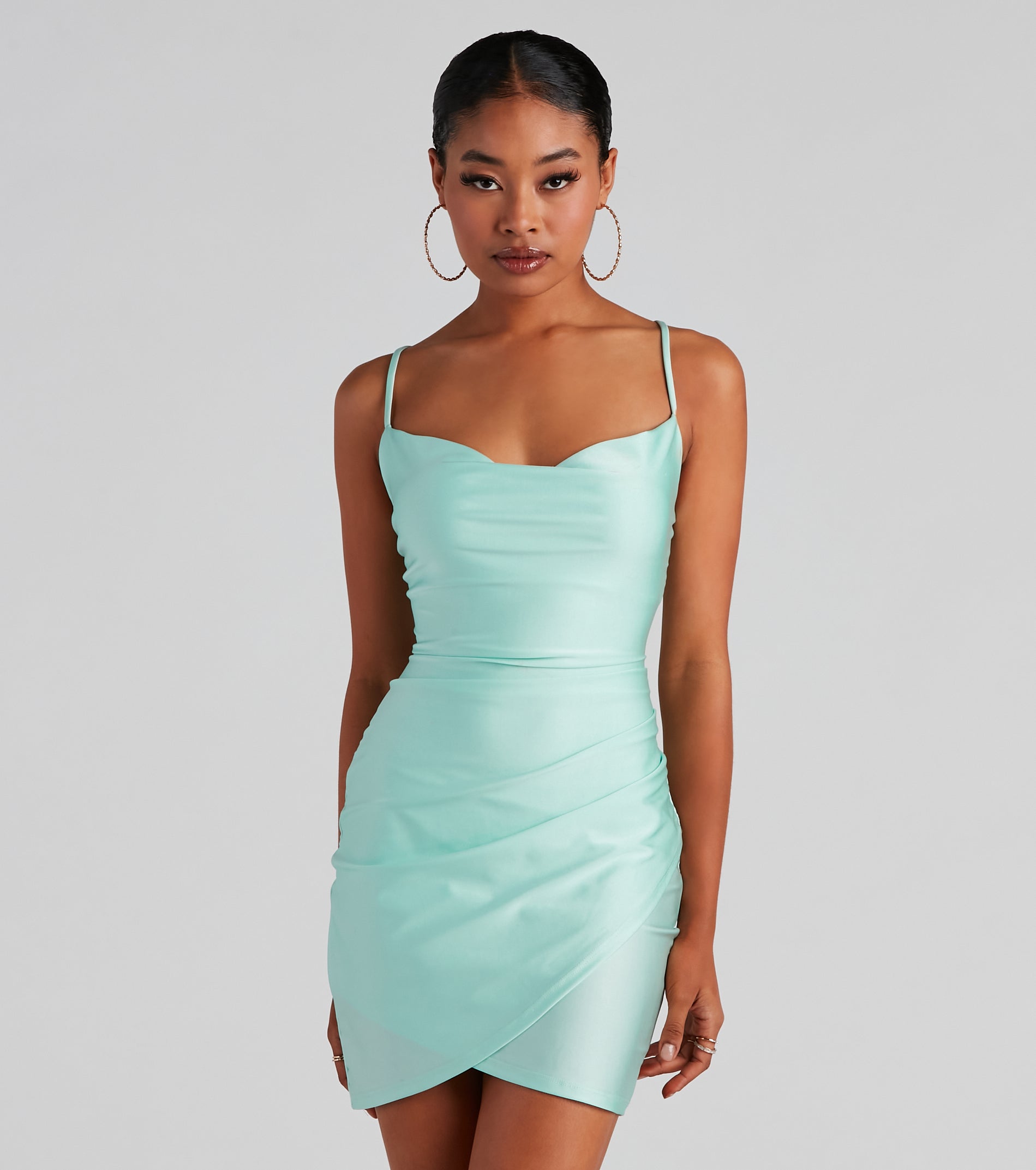 Level up your club dress with the All The Right Moves Cowl Neck Mini Dress to create a trendy Vegas outfit or nightclub dress with the hottest details!