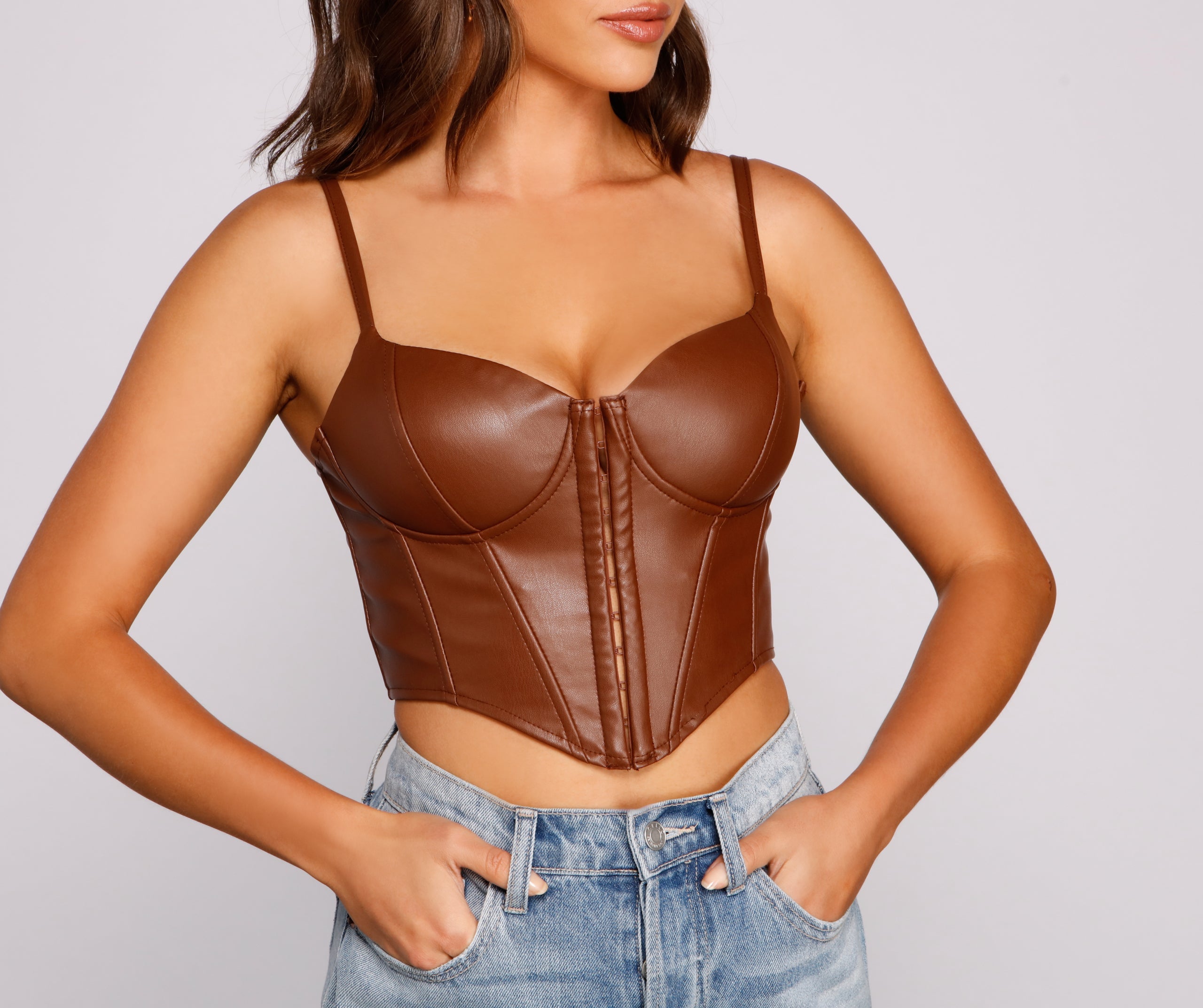 With fun and flirty details, the Bold Moment Faux Leather Corset Top shows off your unique style for a trendy outfit for summer!