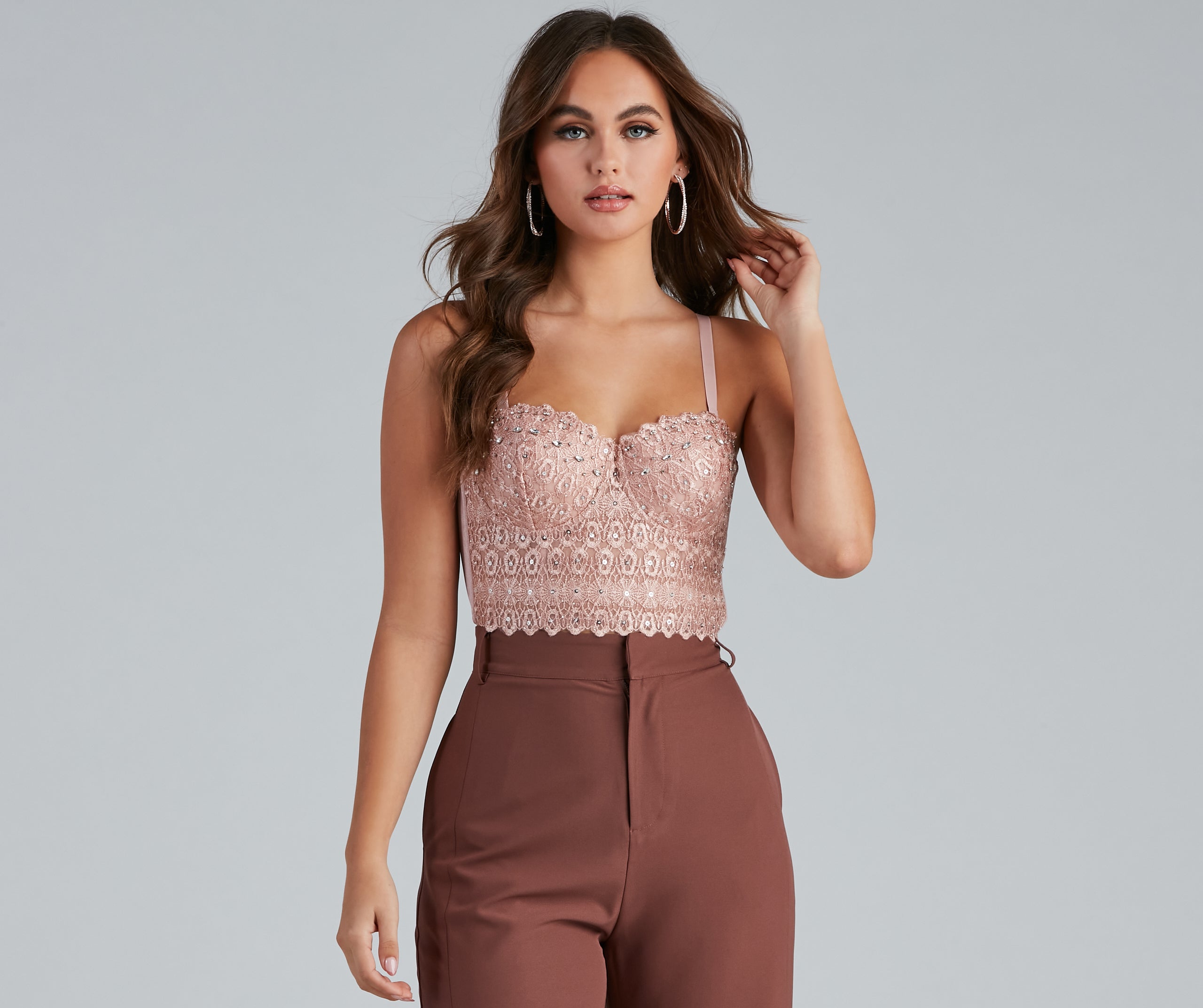 The waist-defining bodice style of the Reigning Lace Bustier Top is perfect for making a statement with your outfit and provides the boning, molded cups, or lace-up details that capture the corset trend.