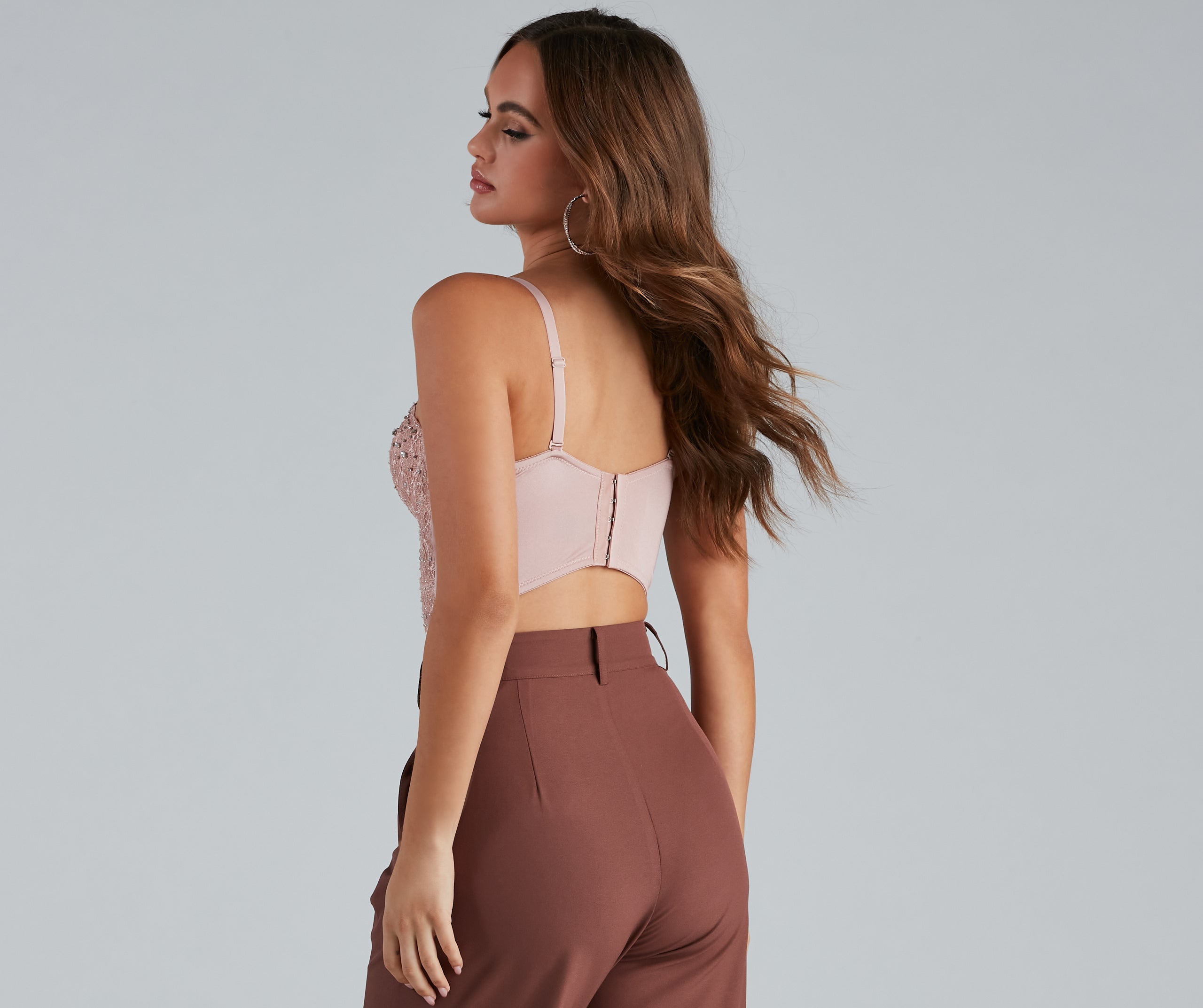 The waist-defining bodice style of the Reigning Lace Bustier Top is perfect for making a statement with your outfit and provides the boning, molded cups, or lace-up details that capture the corset trend.