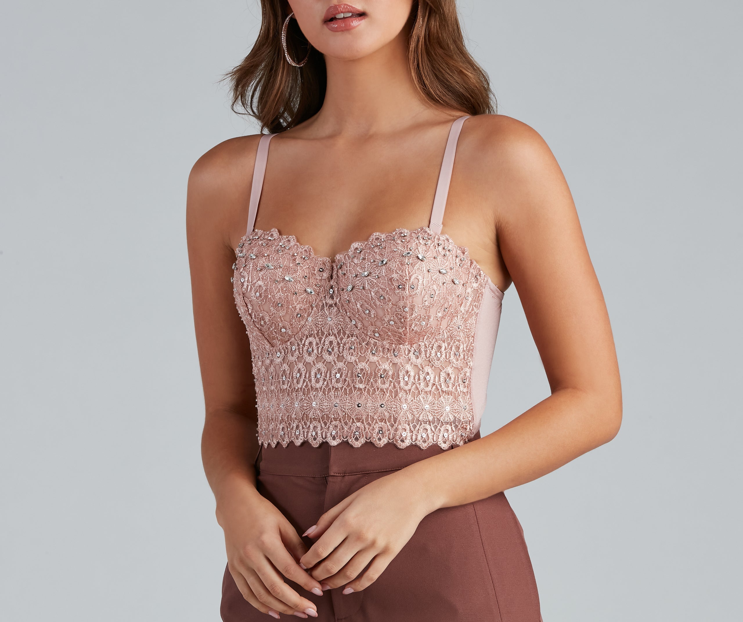 The waist-defining bodice style of the Reigning Lace Bustier Top is perfect for making a statement with your outfit and provides the boning, molded cups, or lace-up details that capture the corset trend.