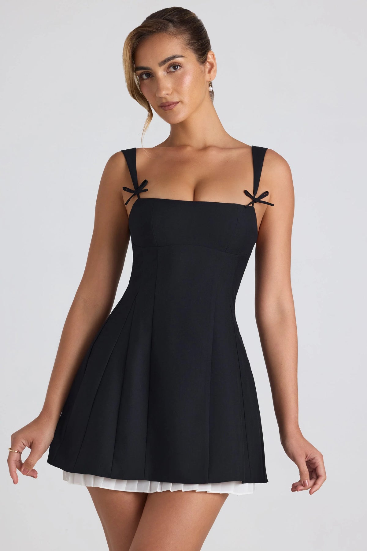 Bow-Embellished Pleated A-Line Mini Dress in Black