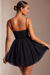 Mini abito con gonna in tulle con corsetto decorato in nero