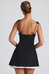 Bow-Embellished Pleated A-Line Mini Dress in Black