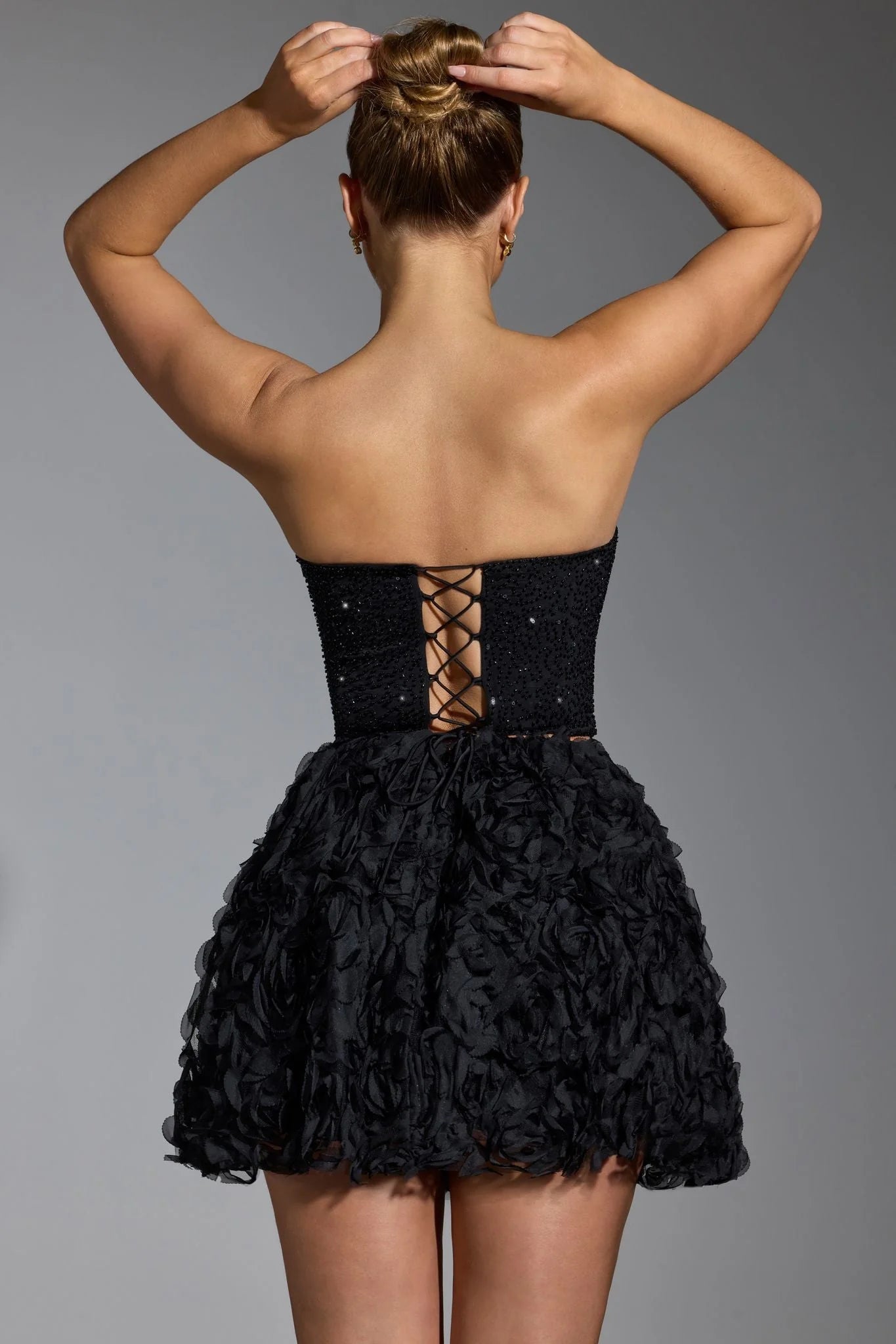 Top a corsetto decorato in nero