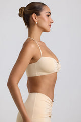 Bralette con dettagli hardware in jersey attillato al collo in crema di burro