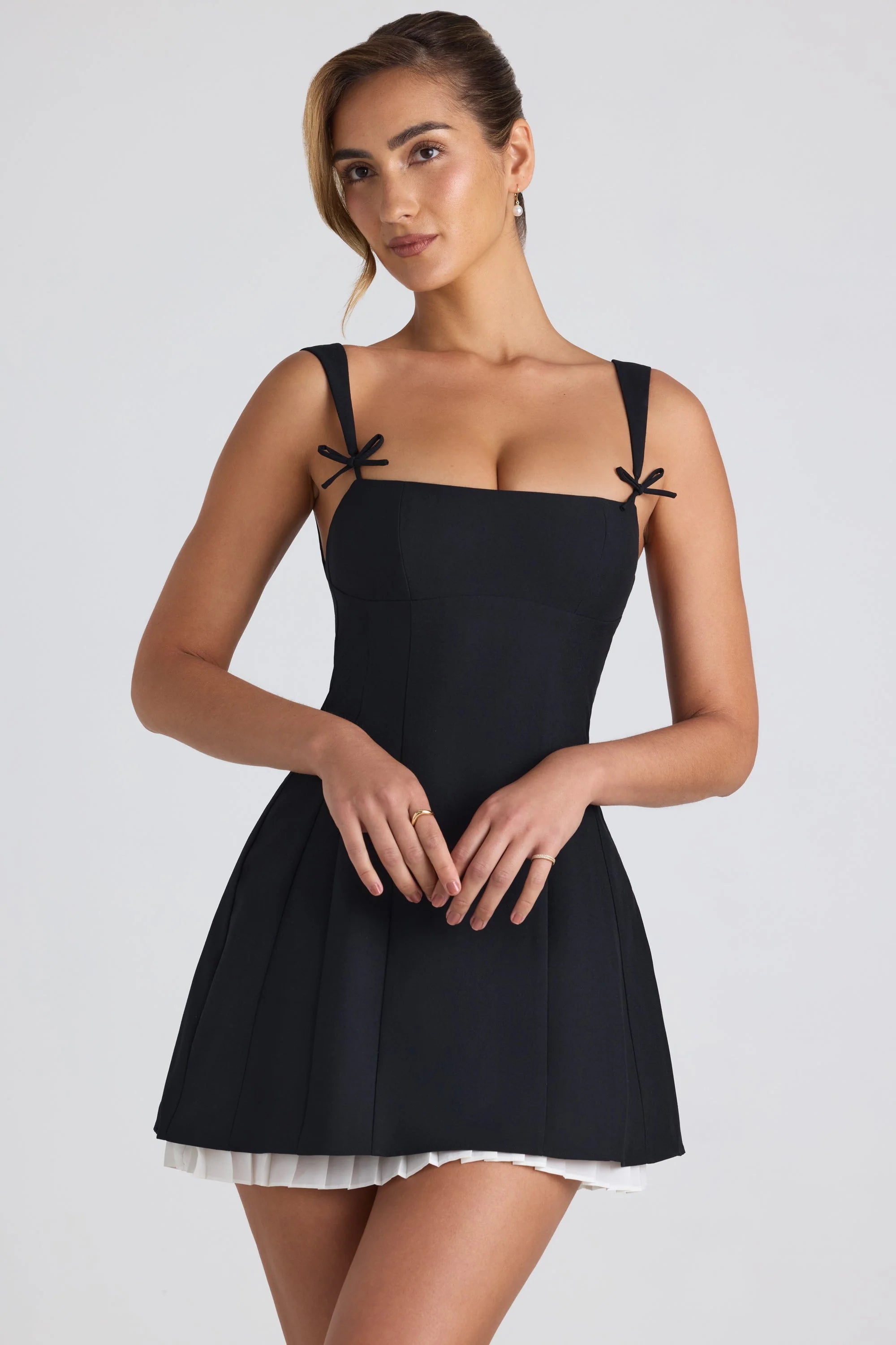 Bow-Embellished Pleated A-Line Mini Dress in Black