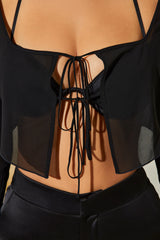 Bralette con volant a maniche lunghe e rivestimento trasparente in nero